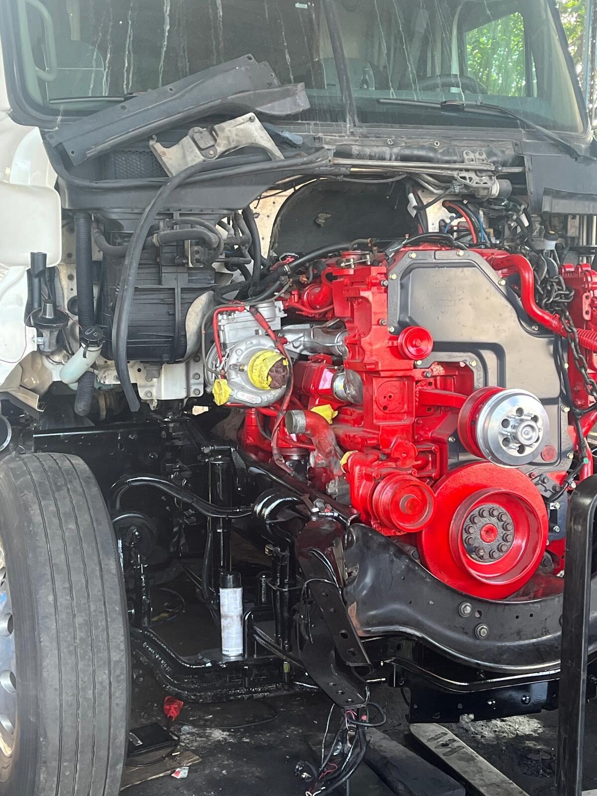 Truck with cab tilted and diesel engine exposed